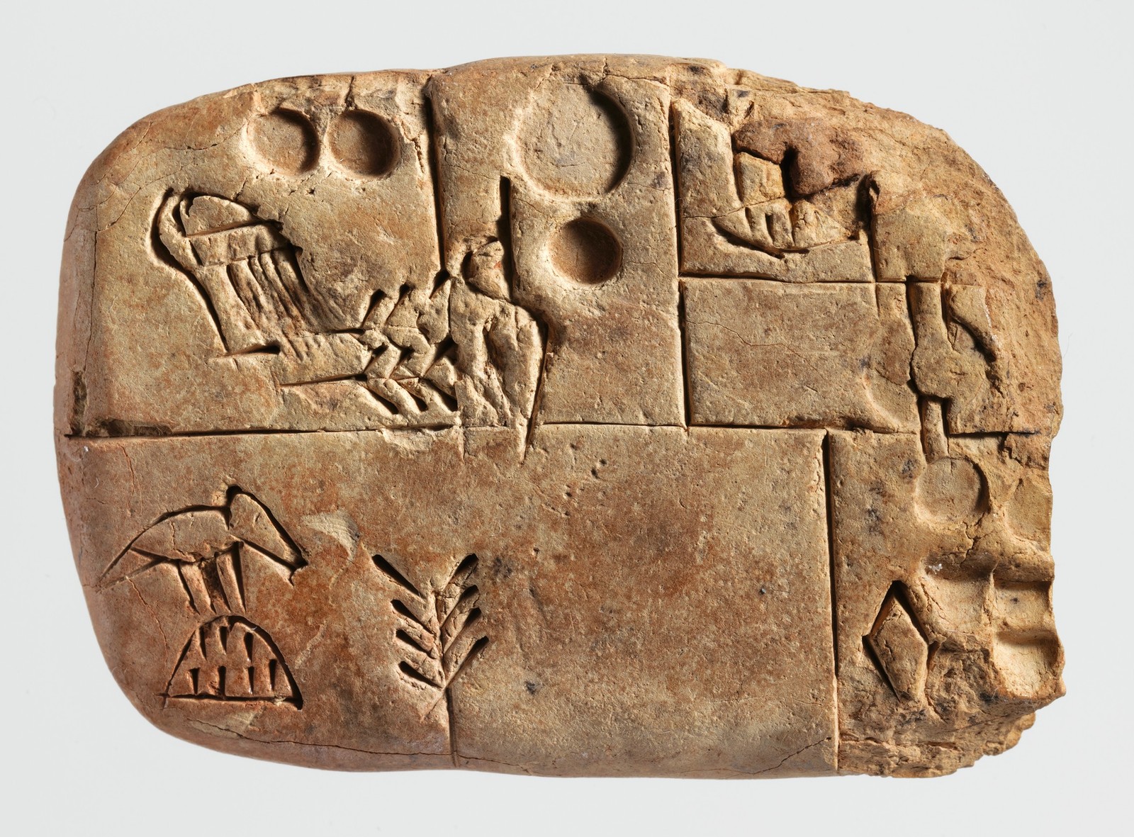 Grain account, Met 1988.433.2, ca. 3100–2900 BCE; probably from Uruk, not the first known tablet. Display copy removes empty background around the object