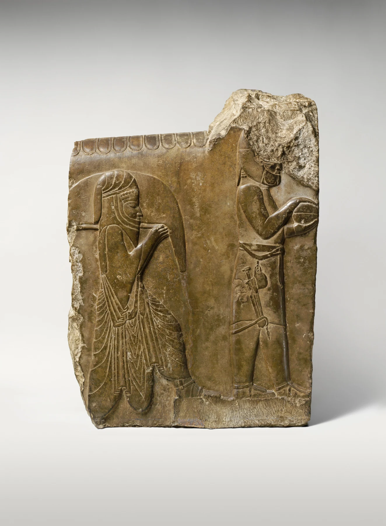 Limestone relief of two servants carrying food and drink, Persepolis, ca. 358–338 BCE, under Artaxerxes III. Metropolitan Museum, 34.158, public-domain photograph. Evidence for the representation of banquet service, not Esther, Haman or a banquet of Xerxes