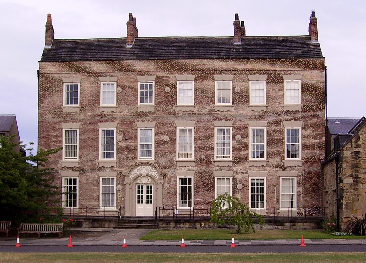 Cosin’s Hall on Palace Green in Durham, England. The original photograph dates from July 2006; this crop was made available later by the source. The building provides context for Durham University, where Nathan J. Chambers completed his thesis in 2017