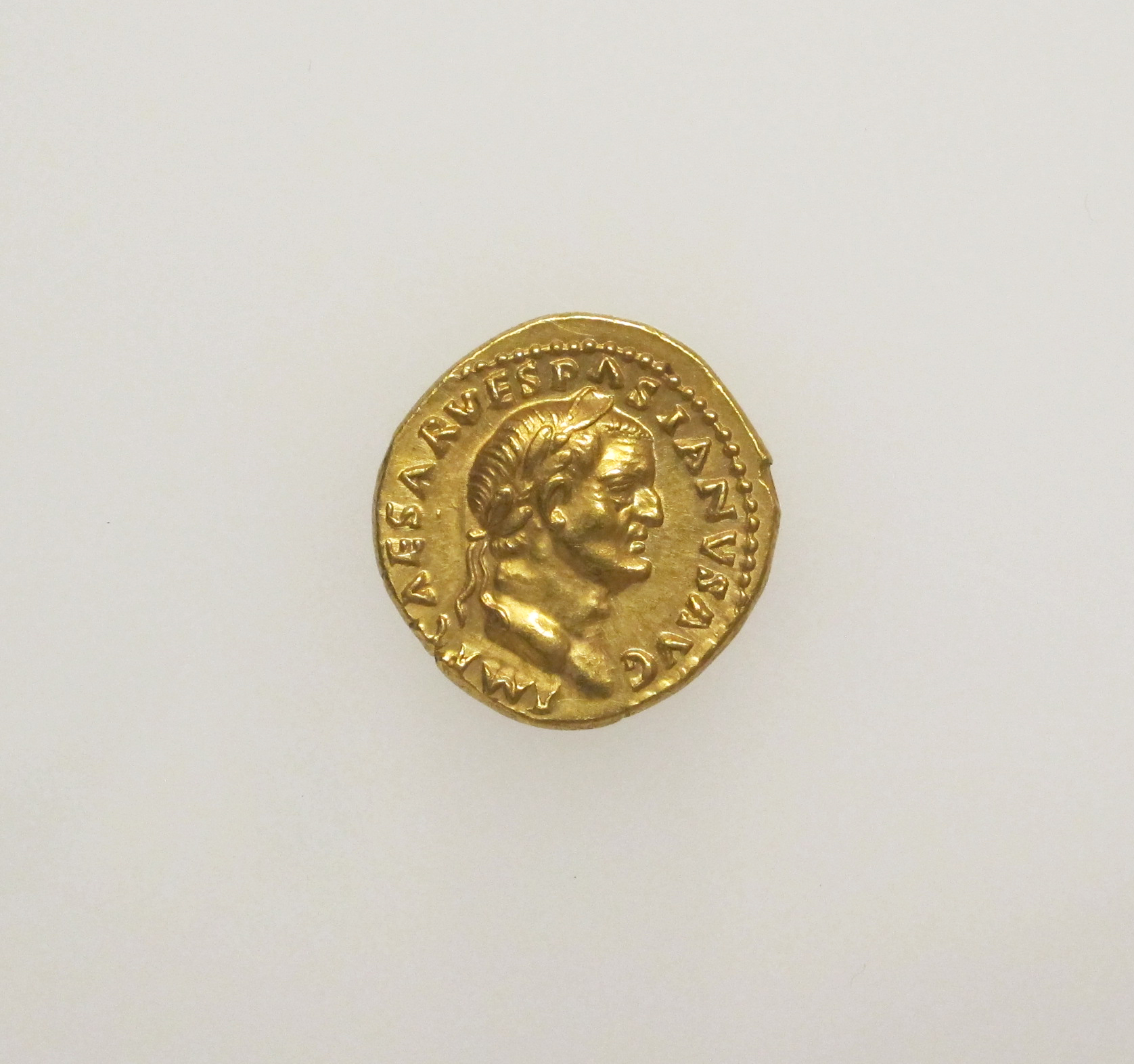 Roman gold aureus bearing Vespasian's portrait and name, minted in 70 CE. A contemporary witness to the emperor, not to Josephus's exorcism scene. Met 99.35.154; public domain