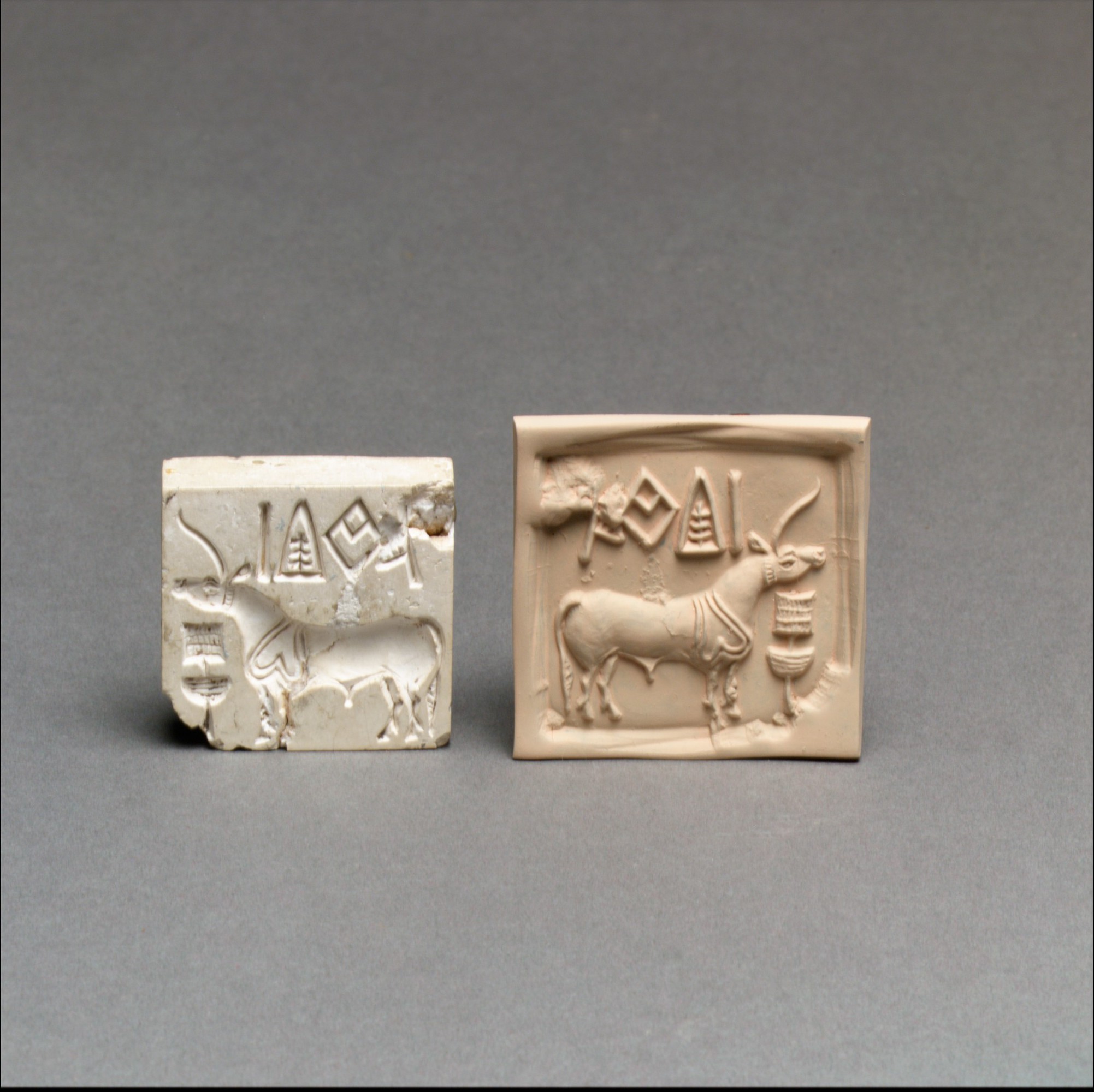 Indus seal and modern impression, about 2600–1900 BCE; Met 49.40.1. A single-horned animal and script signs are visible; this is not an identified flood text