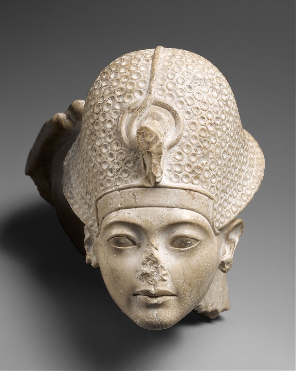 Tutankhamun’s head and remains of Amun’s hand on the crown, limestone, Dynasty 18, The Met 50.6. Fragment of a statue group, not a complete Amun statue; context for renewed royal relations with Amun. Uncropped display copy